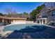 Outdoor pool covered for the off-season with a view of the community clubhouse in the background at 2700 Pine Tree Ne Rd # 4006, Atlanta, GA 30324