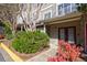 Charming townhouse exterior with well-maintained landscaping and a welcoming entrance at 2700 Pine Tree Ne Rd # 4006, Atlanta, GA 30324