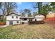 Back exterior of home featuring a covered patio with a fenced yard and mature landscaping at 3457 Scenic Dr, East Point, GA 30344