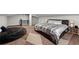 Spacious bedroom featuring wood floors, a stylish rug, and a comfortable beanbag chair at 3457 Scenic Dr, East Point, GA 30344