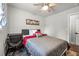 Bedroom with gray comforter, hard wood floors, and desk at 3457 Scenic Dr, East Point, GA 30344