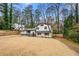 Charming home featuring a unique architectural style, complemented by a spacious front yard and mature trees at 3457 Scenic Dr, East Point, GA 30344