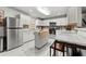Spacious kitchen with white cabinets, stainless steel appliances, and marble floors at 3457 Scenic Dr, East Point, GA 30344
