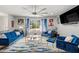 Bright living room featuring hardwood floors, stylish blue furniture, large windows and complete with unique décor and artwork at 3457 Scenic Dr, East Point, GA 30344
