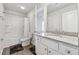 Bright bathroom featuring a shower-tub combo and a granite vanity top at 744 Clark Lake Estates Dr, Grayson, GA 30017