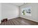 Empty room with wood floors and a window providing natural light at 744 Clark Lake Estates Dr, Grayson, GA 30017