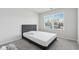 Bright bedroom featuring a large window and neutral decor at 744 Clark Lake Estates Dr, Grayson, GA 30017