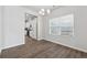 Cozy dining area featuring hardwood floors, adjacent to a bright window and kitchen at 744 Clark Lake Estates Dr, Grayson, GA 30017