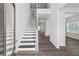 Bright foyer with hardwood floors and staircase leading to the upper level at 744 Clark Lake Estates Dr, Grayson, GA 30017