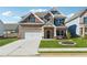 Beautiful two-story brick home with a well-manicured lawn and inviting entrance at 744 Clark Lake Estates Dr, Grayson, GA 30017