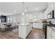 Bright kitchen with a large island, stainless steel appliances, and an adjacent dining area at 744 Clark Lake Estates Dr, Grayson, GA 30017