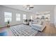 Bright open floor plan with modern décor, a stylish rug, and a comfortable sofa at 744 Clark Lake Estates Dr, Grayson, GA 30017