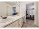 Bathroom with bright vanity and mirror, with a view of bedroom through doorway at 175 Lagrange Ct, Fayetteville, GA 30214