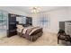 Bedroom with large windows, carpet flooring, and matching furniture set at 175 Lagrange Ct, Fayetteville, GA 30214