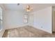 The bedroom offers neutral walls, carpet, a ceiling fan, a window and closet at 175 Lagrange Ct, Fayetteville, GA 30214