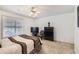 Bedroom with standard ceiling fan, carpet flooring, and dark wood furniture at 175 Lagrange Ct, Fayetteville, GA 30214