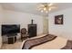 Comfortable bedroom featuring neutral colors, soft carpet, and standard ceiling fan at 175 Lagrange Ct, Fayetteville, GA 30214