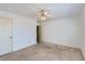 Bright bedroom with plush carpet, white walls, ceiling fan, and closet at 175 Lagrange Ct, Fayetteville, GA 30214