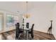 Stylish dining room featuring a glass table and modern chandelier at 175 Lagrange Ct, Fayetteville, GA 30214