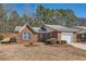 Charming brick home featuring an attached garage and a well-maintained front yard at 175 Lagrange Ct, Fayetteville, GA 30214