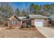 Lovely single-story brick home with attached garage and manicured lawn at 175 Lagrange Ct, Fayetteville, GA 30214