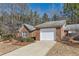 Single story brick house with attached garage and concrete driveway at 175 Lagrange Ct, Fayetteville, GA 30214