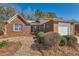 Charming brick home with attached garage and mature landscaping at 175 Lagrange Ct, Fayetteville, GA 30214