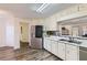 Spacious kitchen featuring stainless steel fridge, ample cabinet space, and modern countertops at 175 Lagrange Ct, Fayetteville, GA 30214
