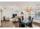 Open-concept living and dining area with a cozy fireplace at 175 Lagrange Ct, Fayetteville, GA 30214