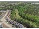 Neighborhood aerial view features charming homes near a lush green space, combining suburban and natural elements at 2031 Broadmoor Way, Fairburn, GA 30213