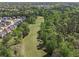Aerial view showcasing neighborhood homes near a lush wooded area, offering nature and community at 2031 Broadmoor Way, Fairburn, GA 30213