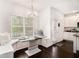 Cozy eat-in kitchen nook with custom seating and a view to the backyard at 2031 Broadmoor Way, Fairburn, GA 30213