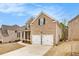 Beautiful two-story brick home with a two-car garage and well-maintained landscaping at 2031 Broadmoor Way, Fairburn, GA 30213
