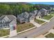 Brick two-story home boasting a two-car garage, well-kept lawn, and traditional design at 2031 Broadmoor Way, Fairburn, GA 30213