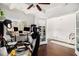 Home office with built-in storage, dark wood floors, and a calming color scheme at 2031 Broadmoor Way, Fairburn, GA 30213
