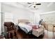 Main bedroom with a trey ceiling and space for a workout area at 2031 Broadmoor Way, Fairburn, GA 30213