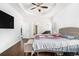 Spacious main bedroom featuring a tray ceiling, dark wood floors, and neutral color palette at 2031 Broadmoor Way, Fairburn, GA 30213