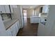 Bright kitchen with white cabinets, mosaic backsplash, and ample counter space at 545 Woodrow Dr, Lawrenceville, GA 30043