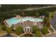 Aerial view of a community pool with waterslides and a clubhouse, offering recreational opportunities at 1311 Lakeside Overlook, Canton, GA 30114