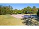 Outdoor basketball court surrounded by trees and grass, creating a recreational space at 1311 Lakeside Overlook, Canton, GA 30114