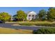 Elegant clubhouse featuring stately columns, manicured landscaping and an inviting entrance at 1311 Lakeside Overlook, Canton, GA 30114