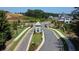 Aerial view of the community entrance, featuring manicured lawns and mature trees at 1311 Lakeside Overlook, Canton, GA 30114