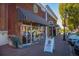 Charming Old School Ice Cream store with striped awning and outdoor seating on a sunny day at 1311 Lakeside Overlook, Canton, GA 30114