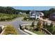 Scenic view of a home in the neighborhood featuring manicured lawns and mature trees at 1311 Lakeside Overlook, Canton, GA 30114