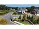 Scenic view of a home in the neighborhood featuring manicured lawns and mature trees at 1311 Lakeside Overlook, Canton, GA 30114