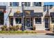 A storefront displays jewelry in its windows with hanging floral baskets, enhancing its charm at 1311 Lakeside Overlook, Canton, GA 30114