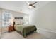 Comfortable bedroom featuring carpet, ceiling fan, and large windows at 455 Registry Blf, Stone Mountain, GA 30087