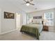 Inviting bedroom with a ceiling fan and windows providing ample natural light at 455 Registry Blf, Stone Mountain, GA 30087