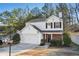 Charming two-story home with a well-maintained front yard and attached two-car garage at 455 Registry Blf, Stone Mountain, GA 30087