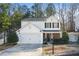 Charming two-story home with a well-maintained front yard and attached two-car garage at 455 Registry Blf, Stone Mountain, GA 30087